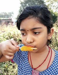 Close-up of boy eating ice cream