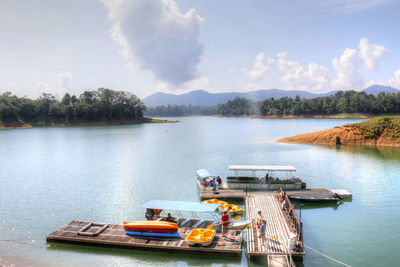 Boats in lake against sky