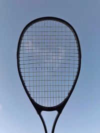 A tennis racket silhouette. 