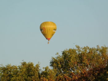 Low angle view of hot air balloon against clear sky