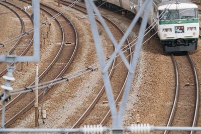 Railroad tracks with train in city