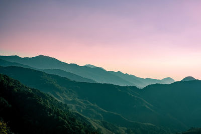 Scenic view of mountains against sky during sunset