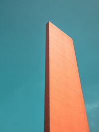 Low angle view of tower against clear blue sky