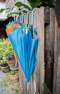 Close-up of clothes drying against blue sky