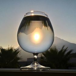 Illuminated lights against sky