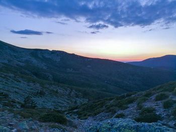 Scenic view of mountains against sky during sunset