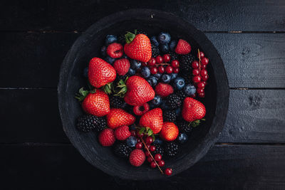 High angle view of strawberries in bowl on table