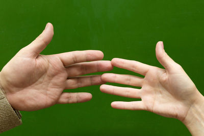 Cropped image of people hand against blurred background