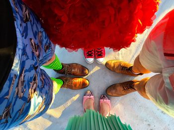 Low section of people sitting on beach