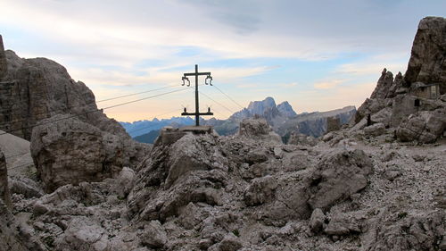 Scenic view of mountains against cloudy sky