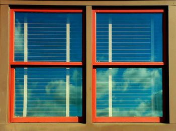 Reflection of building on glass window