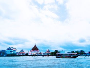 View of sea against buildings