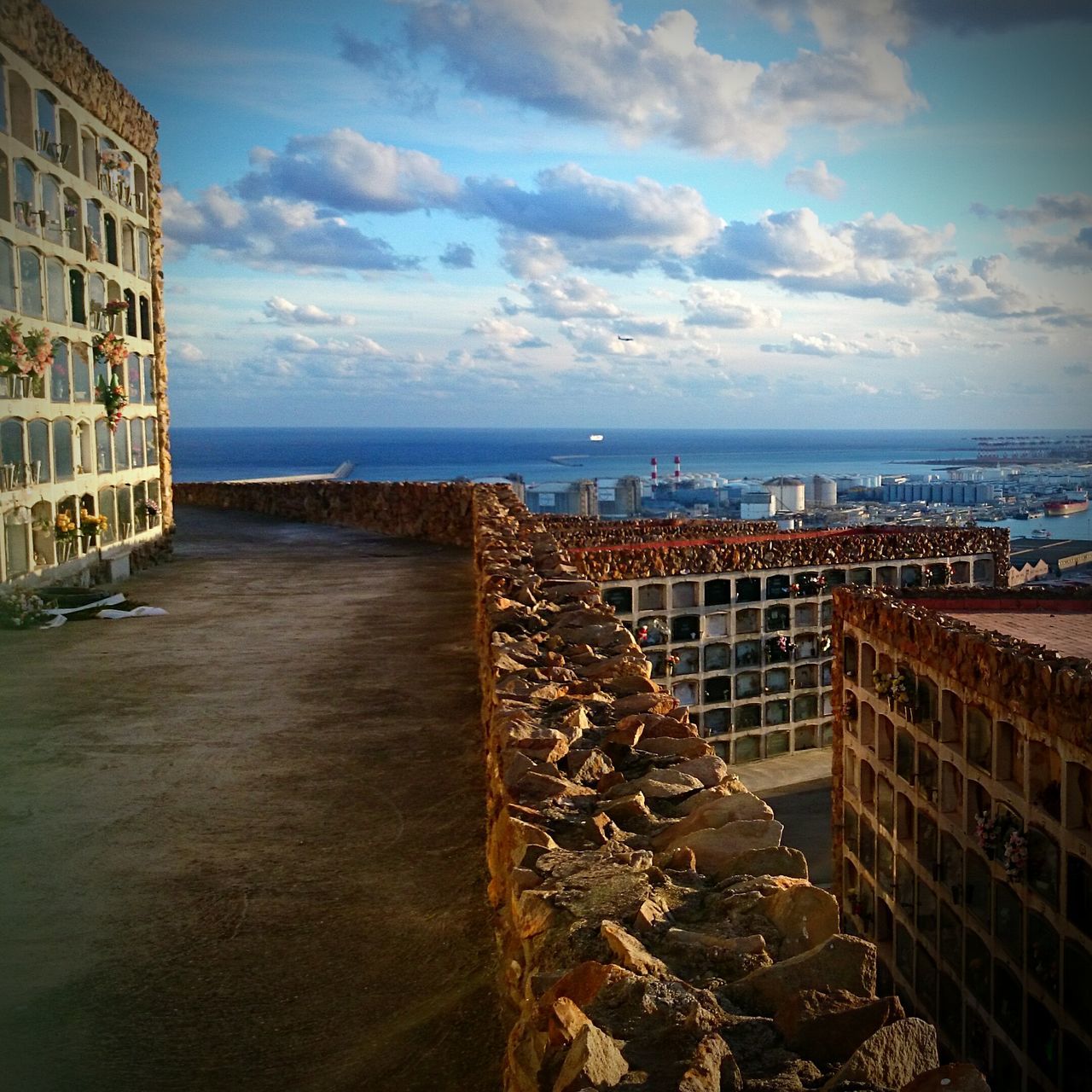 sea, sky, horizon over water, water, architecture, built structure, building exterior, cloud - sky, beach, cloud, city, cloudy, shore, day, nature, outdoors, high angle view, scenics, residential building, residential structure