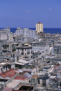 High angle view of townscape against blue sky