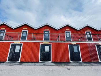 A view of red wooden houses on donso archipelago island .