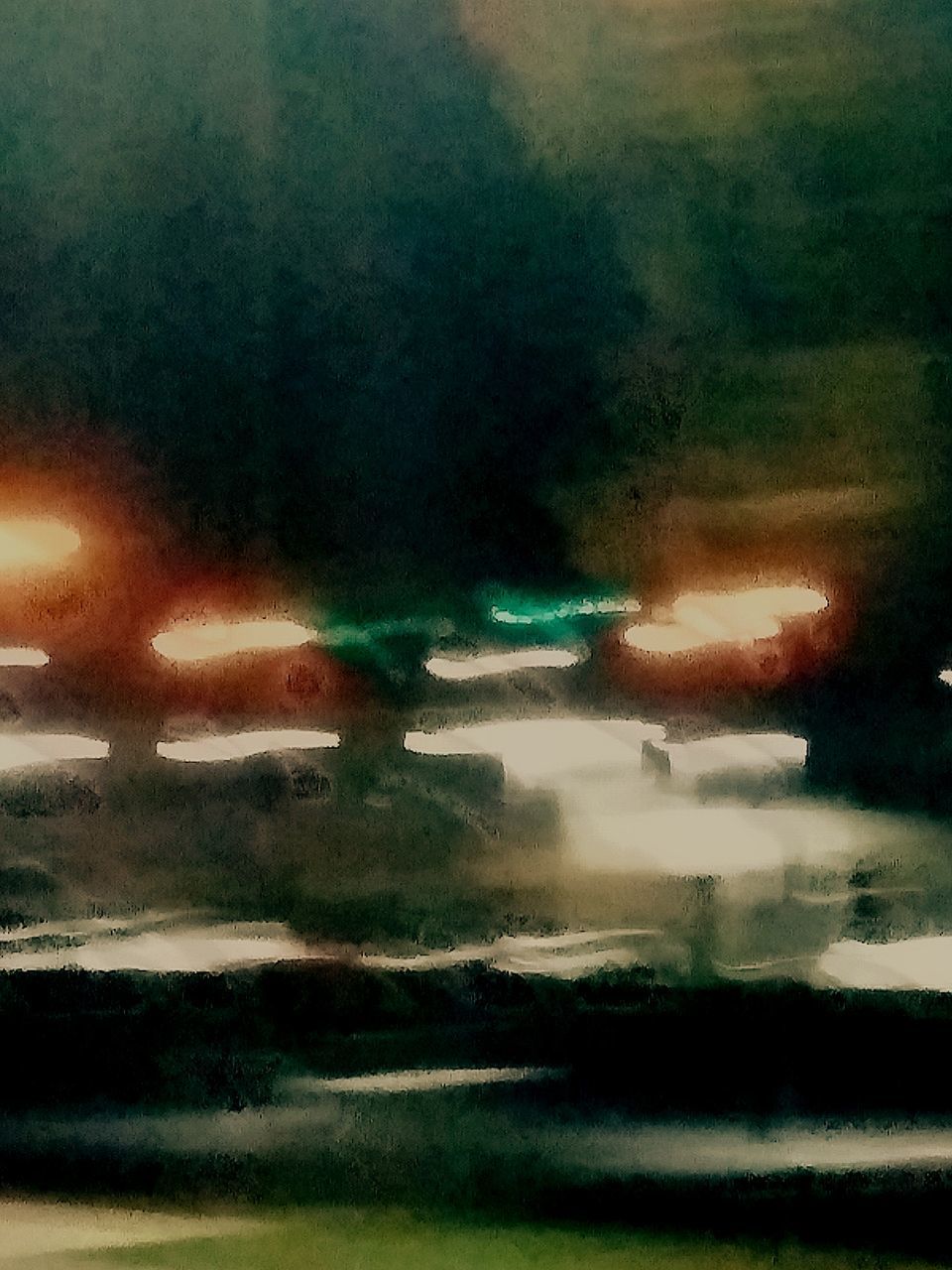 CAR ON ILLUMINATED STREET AGAINST SKY AT NIGHT