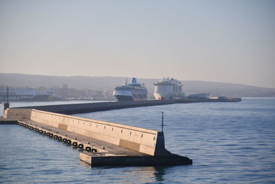 Ship in sea against clear sky