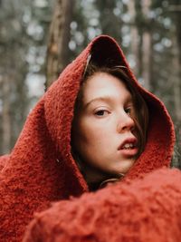 Close-up portrait of young woman with scarf