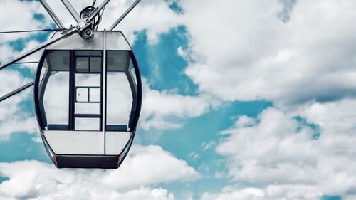 Low angle view of ski lift against sky