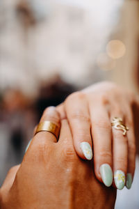 Cropped image of couple holding hands