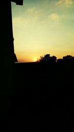 Silhouette landscape against sky during sunset