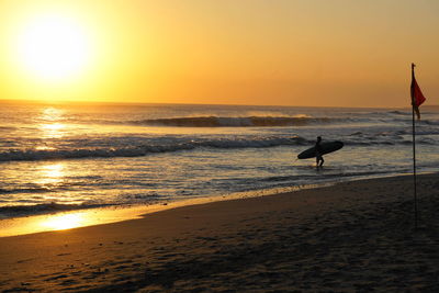 Scenic view of beach during sunset