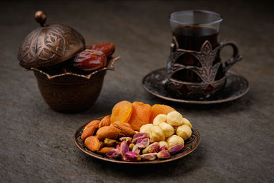 Dates, dried apricots, nut mix and tea. fasting during islam holy month. ramadan kareem