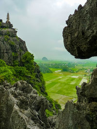 Scenic view of mountain against cloudy sky