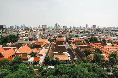 High angle view of buildings in city against sky