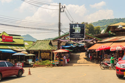 Street market against buildings in city