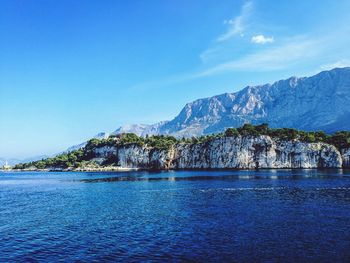 Scenic view of sea against blue sky