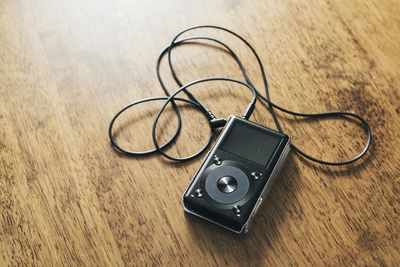 High angle view of audio equipment on wooden table