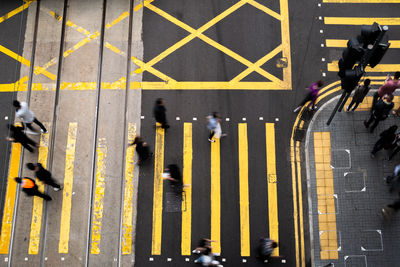 High angle view looking at blurred people crossing the road