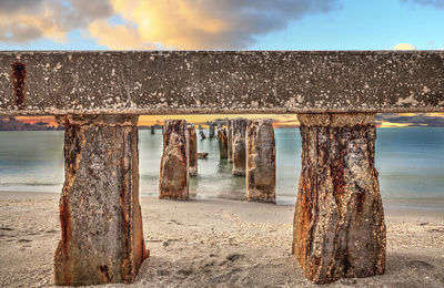 Sunset over old abandoned stone fishing pier called bocahenge is l shaped and found in boca grande 