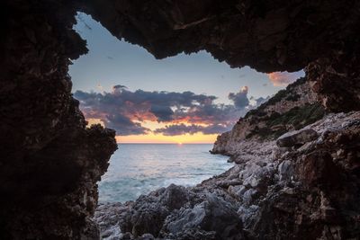 Scenic view of sea against sky at sunset