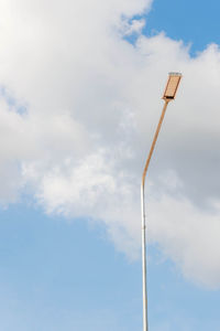 Low angle view of street light against sky