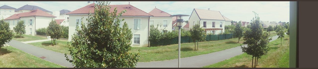 building exterior, architecture, built structure, tree, transfer print, house, grass, sky, growth, plant, lawn, green color, residential structure, window, residential building, auto post production filter, sunlight, day, city, building