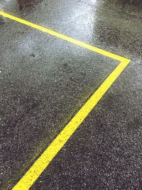 High angle view of marking on wet road