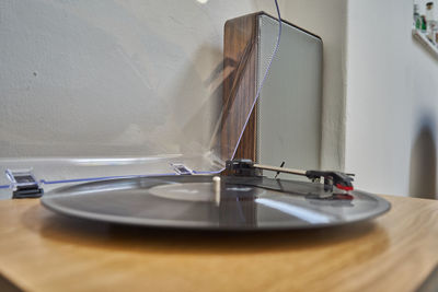 Close-up of vintage car on table against wall