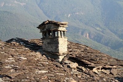 Built structure by sea against sky