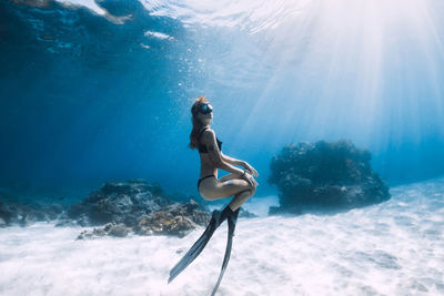 Woman swimming in sea