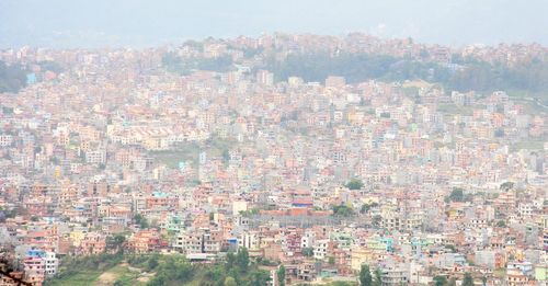 Aerial view of cityscape against sky