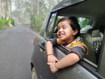 Happy boy in car