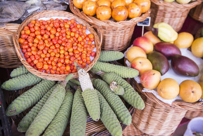 High angle view of fruits in basket at market stall