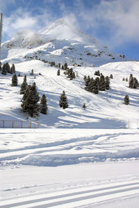 Scenic view of snow covered mountains