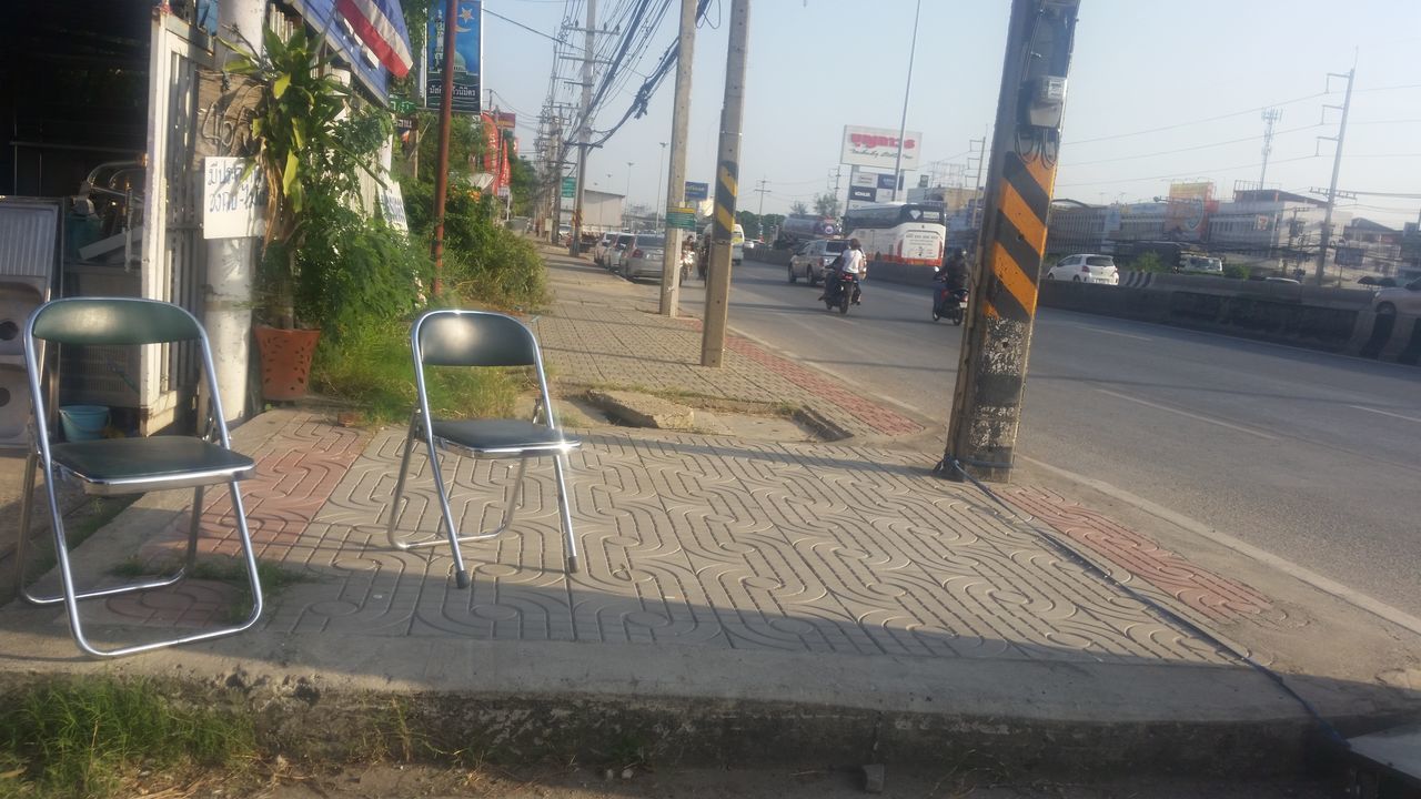 CHAIRS AND CITY IN BACKGROUND