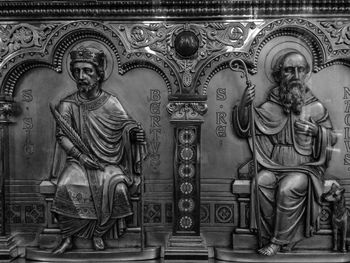 Statue of buddha in temple outside building