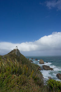 The iconic and historical nugget point light house in new zealand.