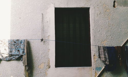 Close-up of clothes drying against building