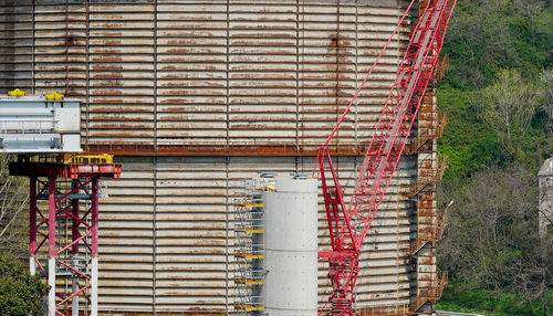 Stack of pipes against wall